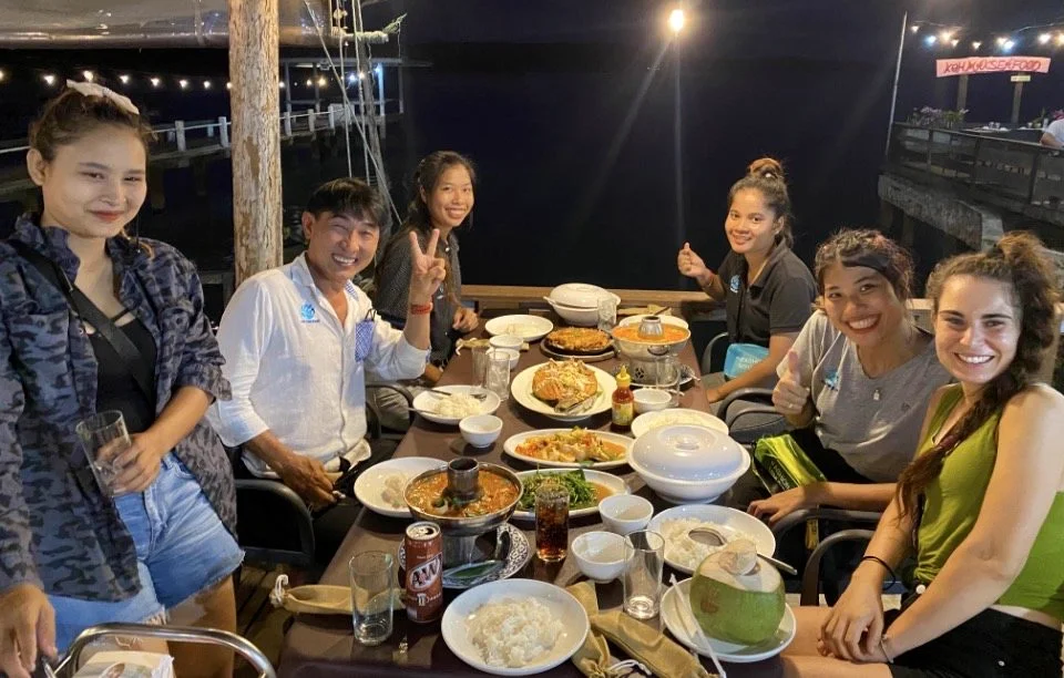 Group dinner at Koh Mak Seafood and Museum — seafood feast over the water
