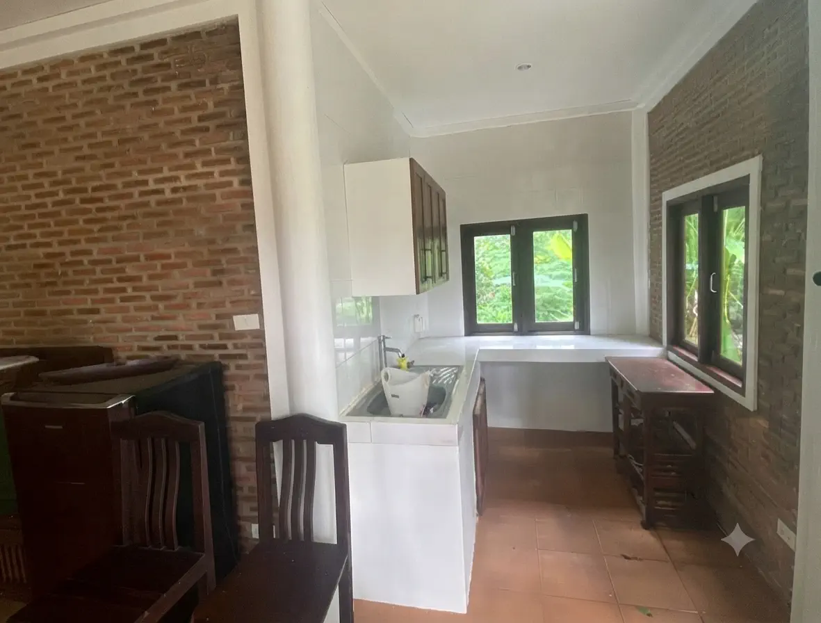 Kitchenette with sink, storage and garden windows at Pineapple Villa on Koh Mak