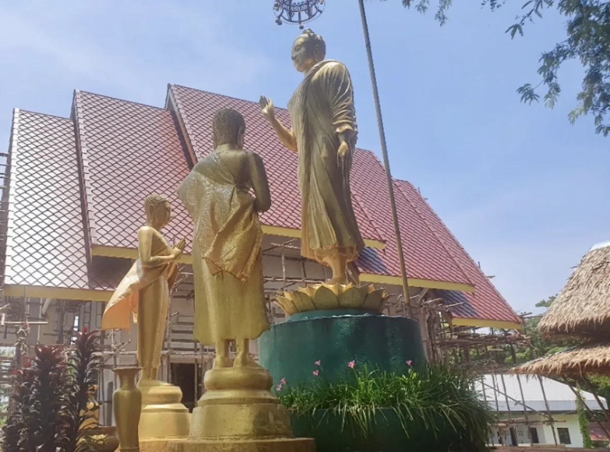 Golden Buddha statues at a Koh Mak temple