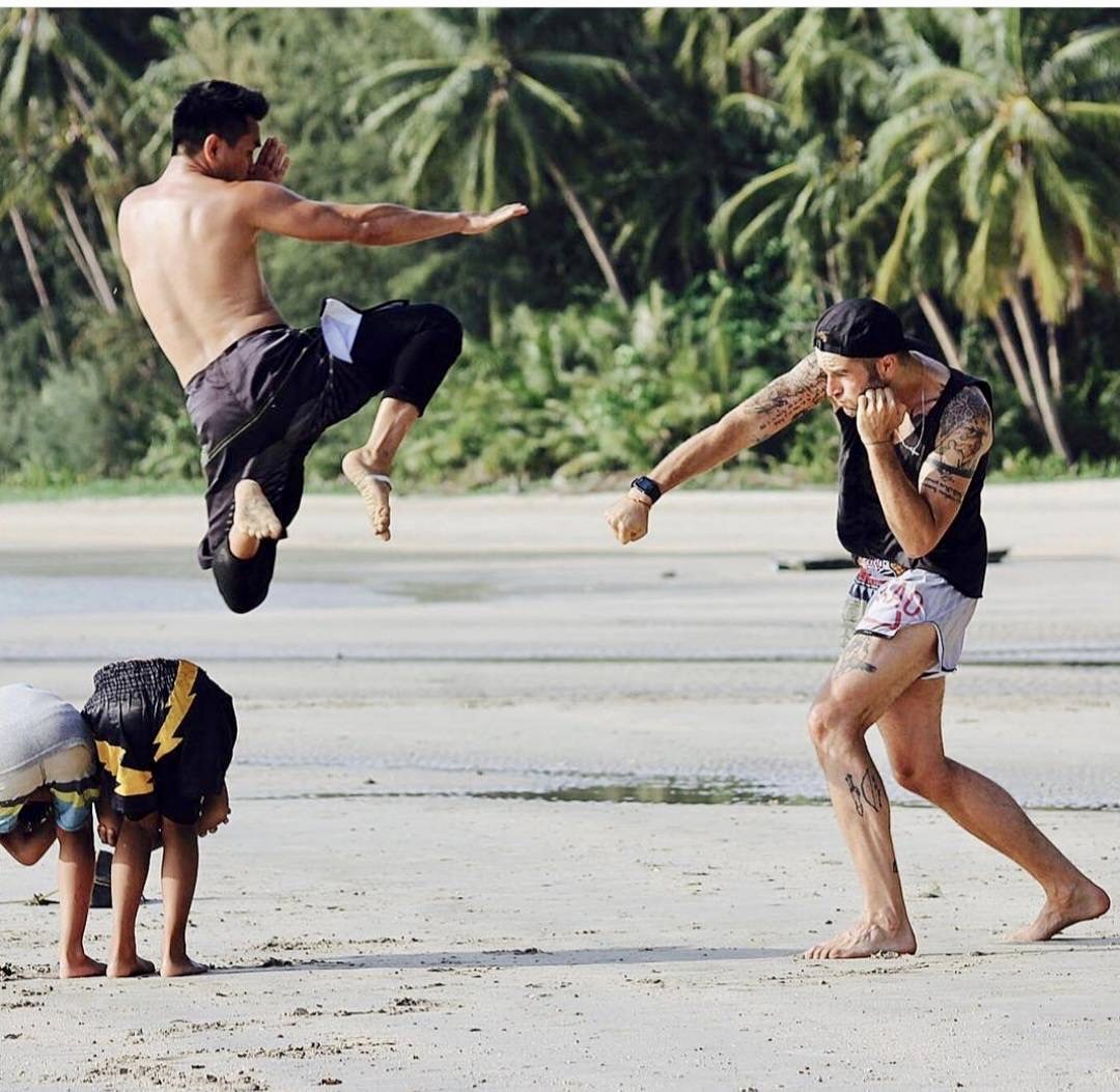 Muay Thai flying-knee drill on the beach at Koh Mak