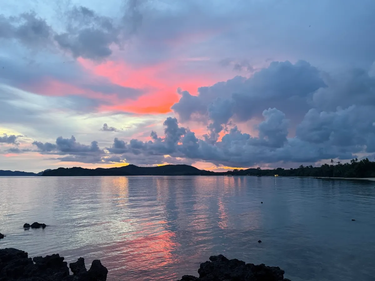 Sunset seascape with colourful sky reflected on calm water around Koh Mak