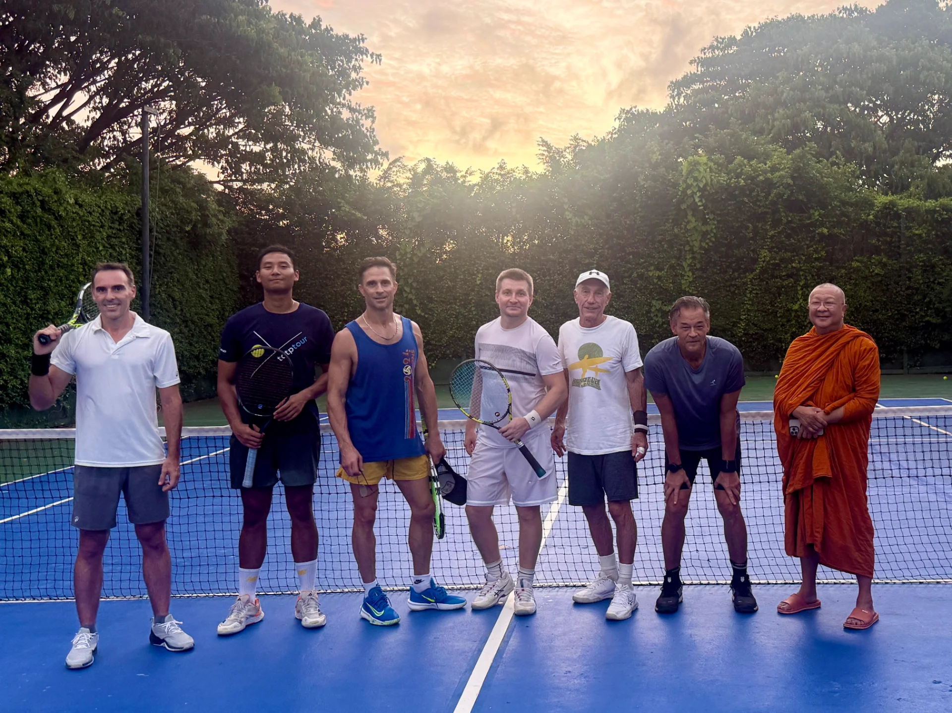 Tennis players on the court at sunset on Koh Mak, Trat