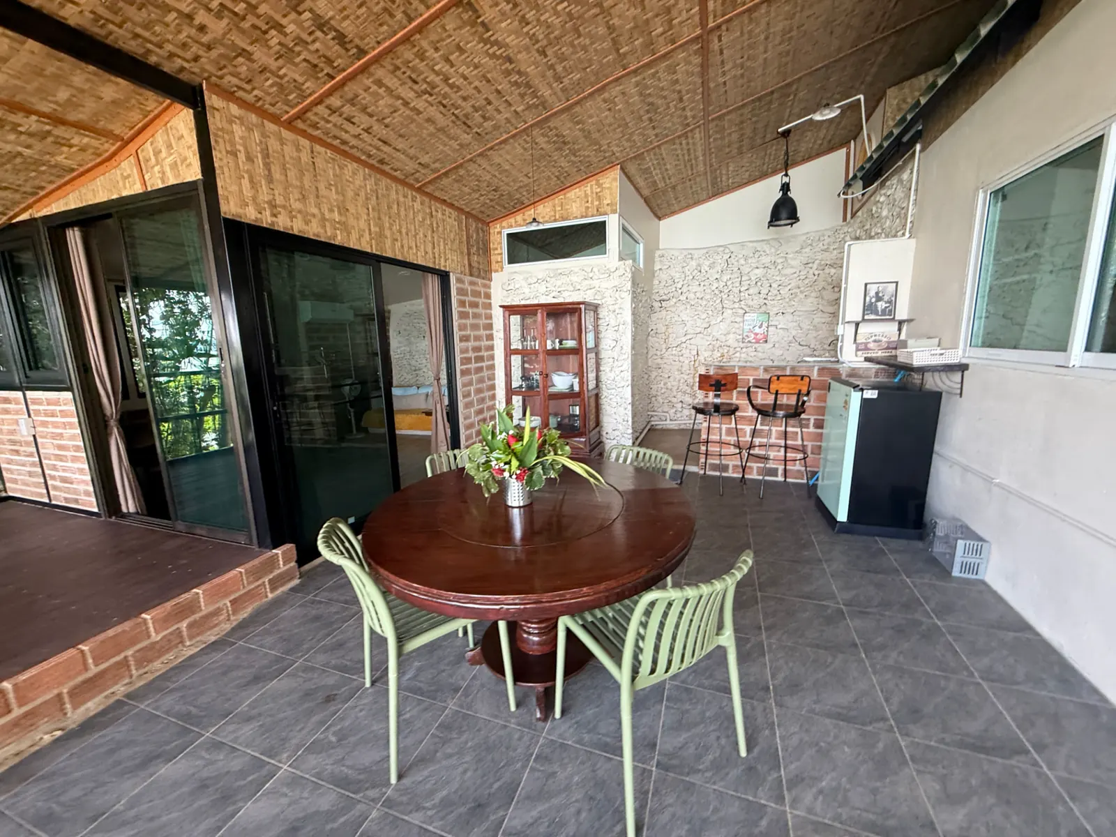 Outdoor kitchenette and dining terrace at Little Bay House, Ao Nid, Koh Mak