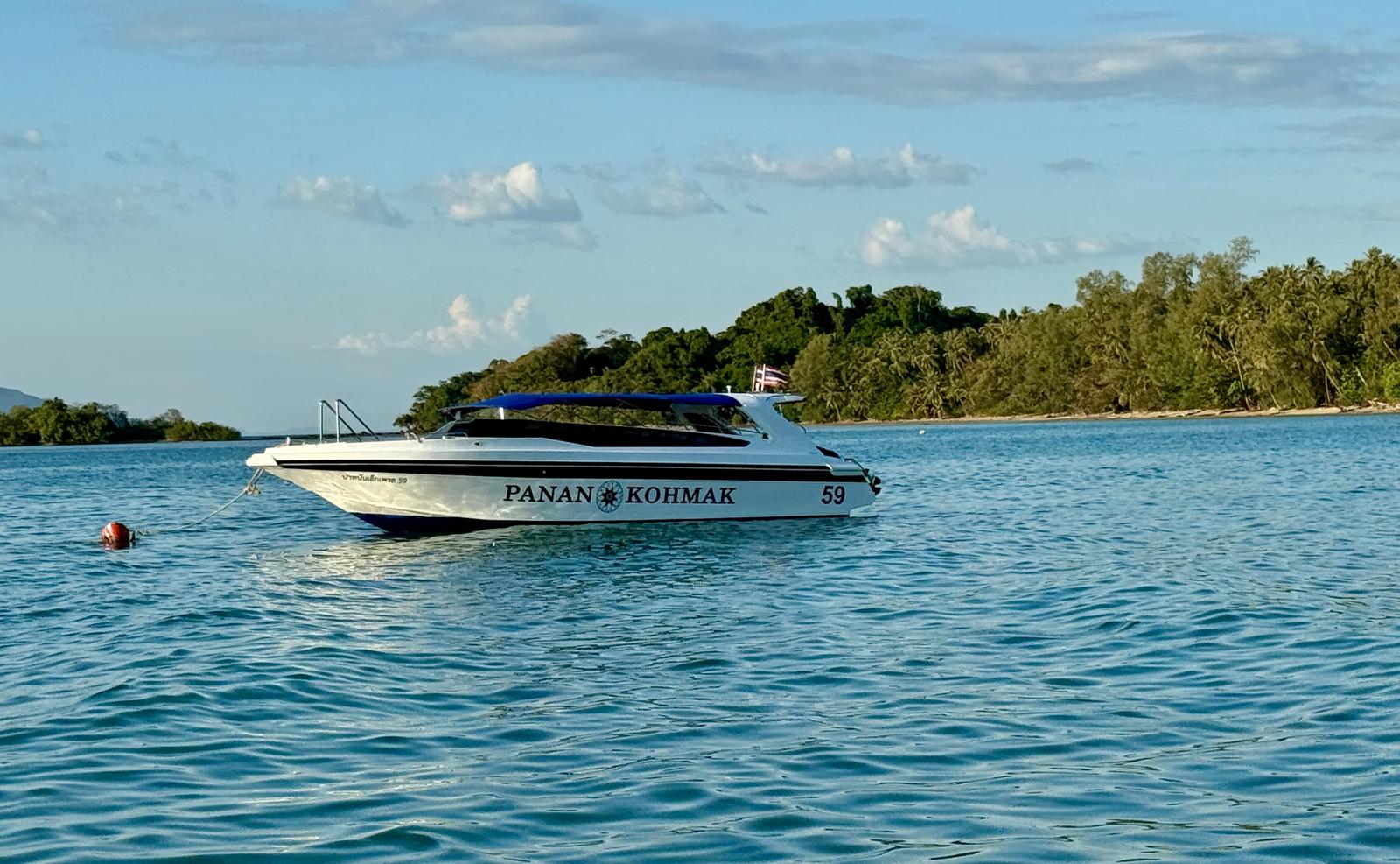 Panan Kohmak speedboat moored in calm turquoise water