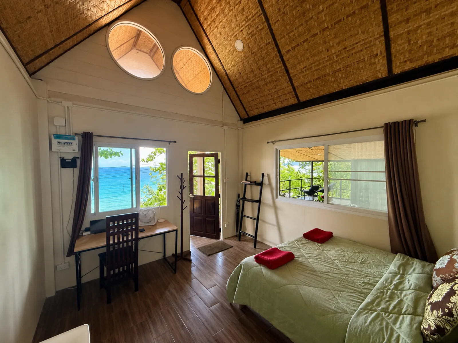 Bedroom with sea view windows at Little Bay House, Ao Nid Pier, Koh Mak