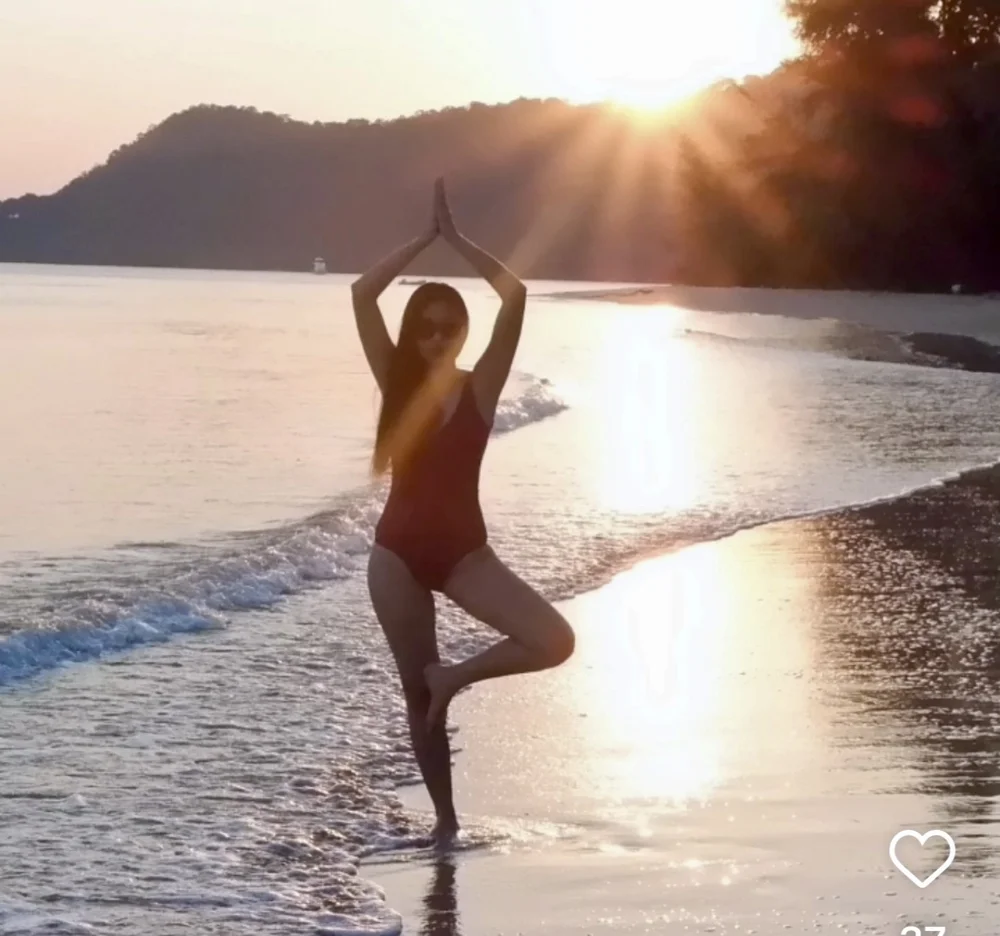 Sunset yoga session on a Koh Mak beach
