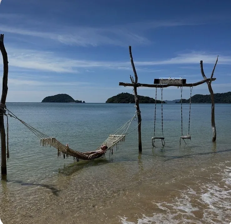 Baan Koh Mak beach restaurant with hammocks and swings over the sea