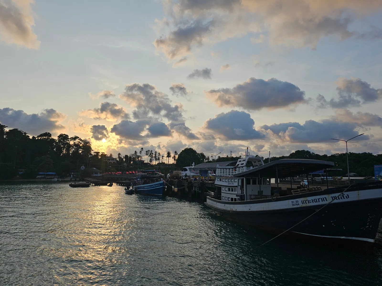 Ao Nid Main Pier at sunset with Boonsiri boat